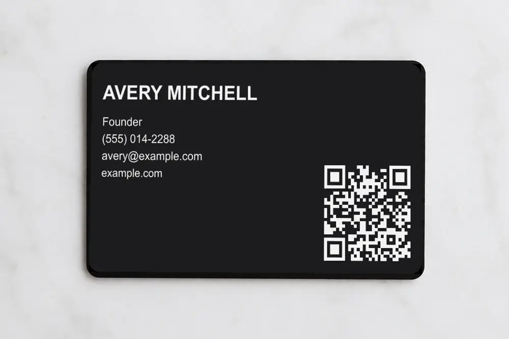 Metal Bümpis card, laser-etched with contact details and a QR code